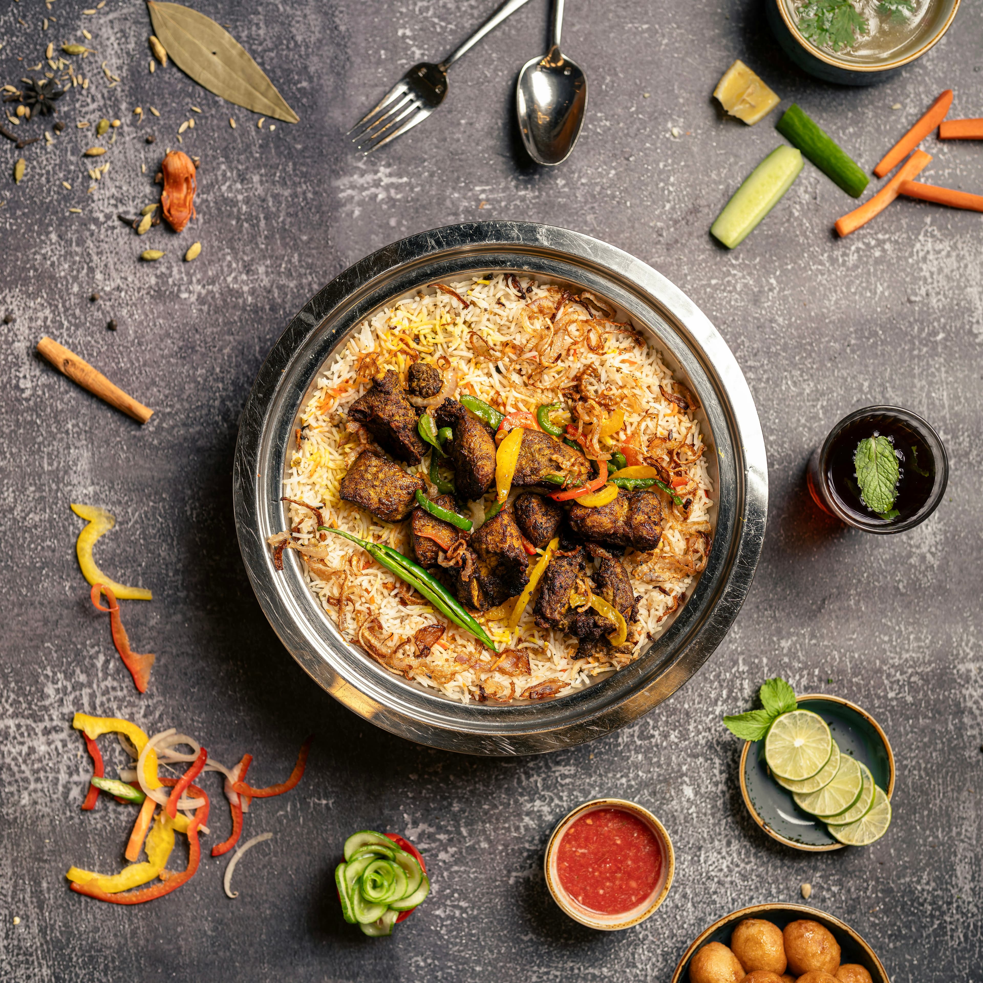 Chicken biryani served with aromatic rice