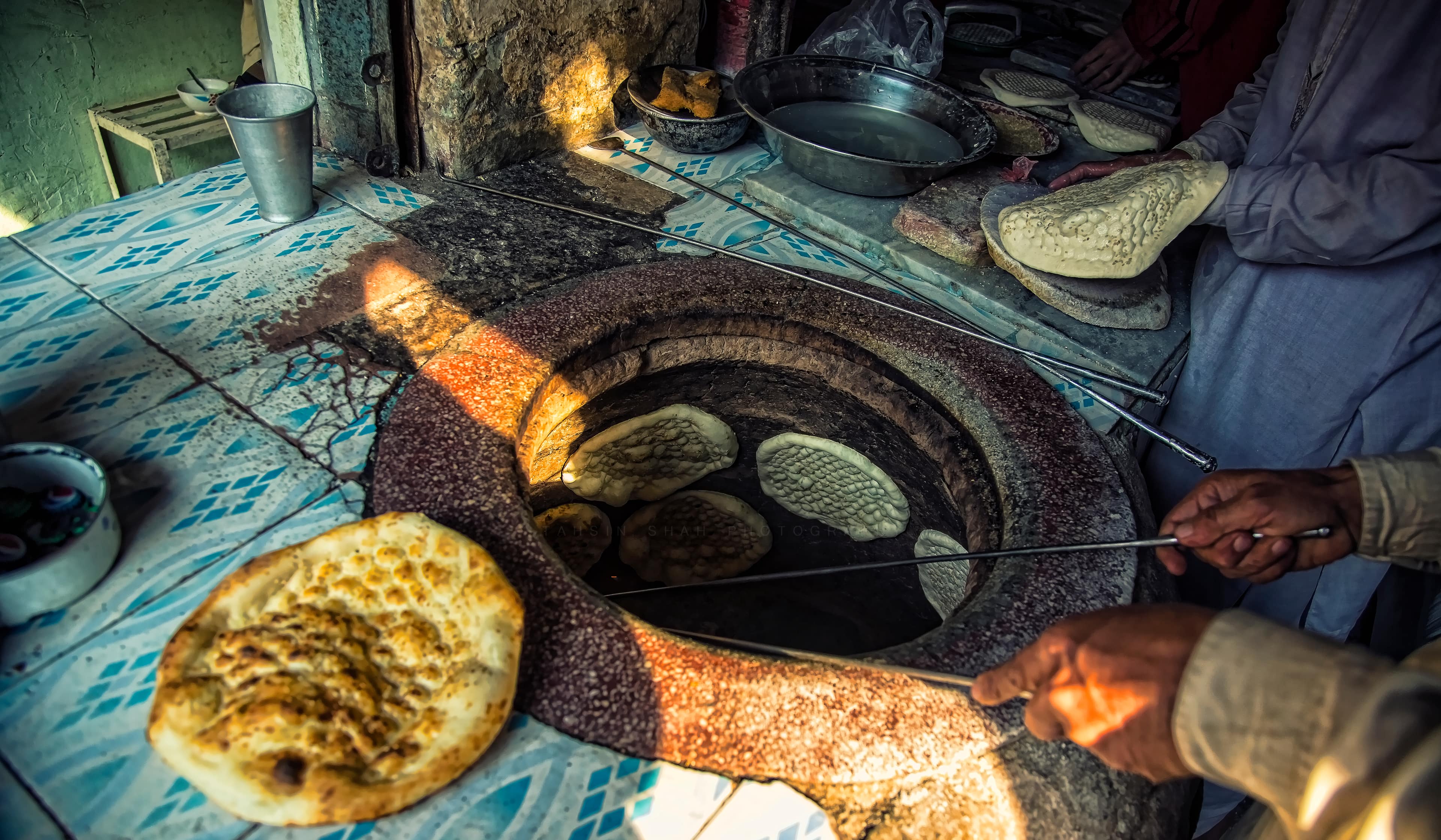 Kitchen flames and tandoor work behind the scenes